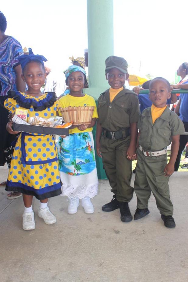 Pupils Donte Beckles, Shiloh Springer, Tamia Watts-Maynard and Astor Jones in their outfits depicting nut-sellers and the Barbados Defence Force soldiers.